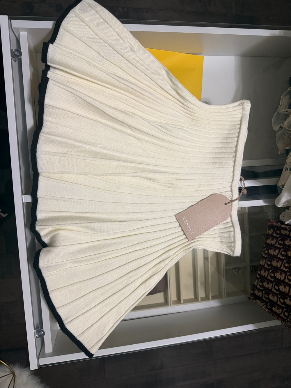 MESHKI white and black pleated Jolene mini skirt